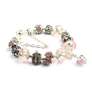 Pink crystal bead bracelet with silver crown pendant and sparkling butterfly charms