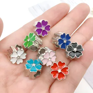 Set of eight colorful enamel cherry blossom beads with sparkling center stones for DIY bracelets