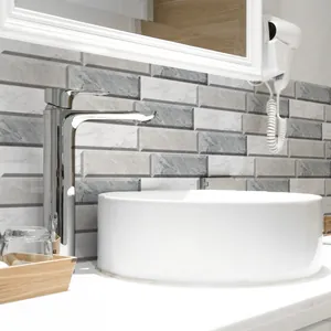 Close-up of marble pattern wall tiles with polished chrome faucet and ceramic basin