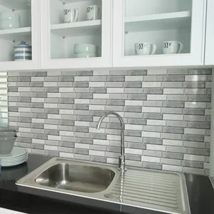 Detailed realistic application of grey and white marble 3D tile stickers in a kitchen