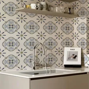 Detail of vintage gray and blue geometric floral tile stickers in a modern kitchen scene