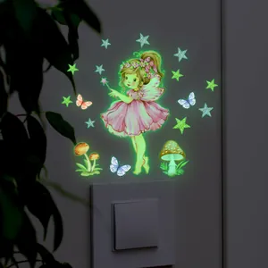 Luminous fairy wall sticker set with glowing stars and butterflies on dark wall