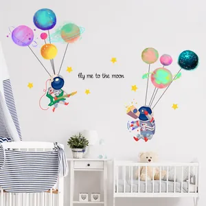 Creative astronaut wall stickers for nursery featuring planets and stars decoration