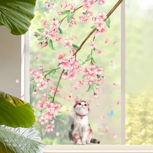 Detalle de pegatina estática para ventana con flores de cerezo, un gato y mariposas