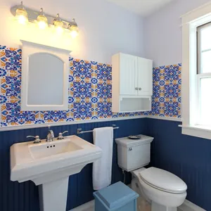 Blue and orange mandala pattern tile stickers applied as a backsplash in a bathroom