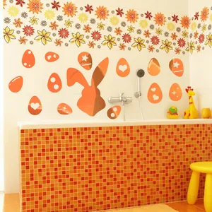 Detail view of orange Easter rabbit and patterned egg wall stickers in bathroom decor