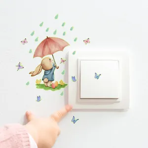 Glow-in-the-dark bunny wall decals with umbrella and colorful butterfly for nursery decor