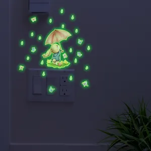 Luminous wall sticker featuring a cartoon rabbit with umbrella and glowing butterflies
