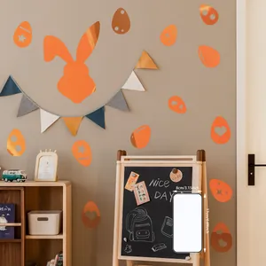 Detailed view of orange bunny and Easter egg wall stickers on a nursery wall