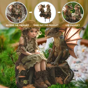 Garden stake detail showing fairy and baby dragon figurine in real outdoor landscape