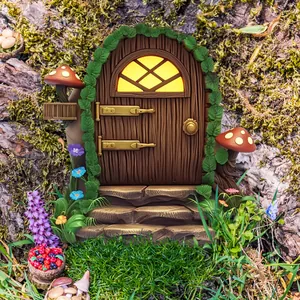 Detail showing miniature fairy door with wood texture, glowing window, and moss on tree bark