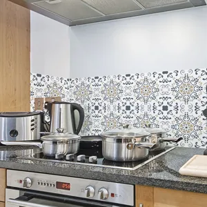 Detail of vintage geometric mandala tile stickers applied on a kitchen backsplash wall