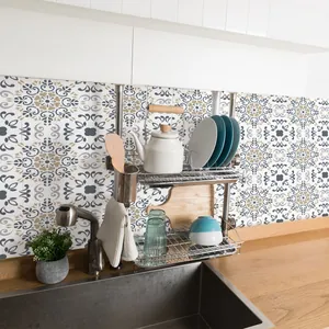 Close-up of vintage blue and grey textured tile stickers applied in a modern kitchen