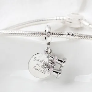 Silver binoculars charm and round tag with engraving on a classic snake chain bracelet