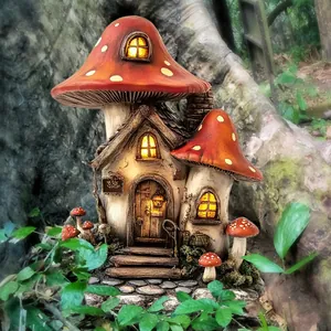 Detail of mushroom fairy house garden stake with glowing windows and resin stairs