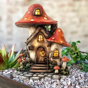 Detailed resin mushroom house ornament with LED glowing windows in garden miniature setup