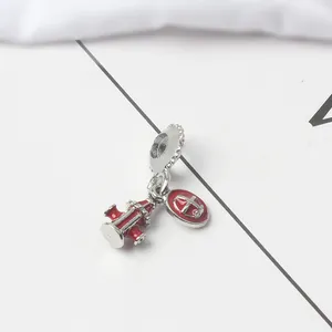 Macro detail of fire hydrant and anchor enamel pendant charm for DIY bracelets