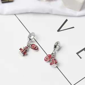 DIY jewelry charms featuring fire hydrant and cross designs with red enamel and silver alloy