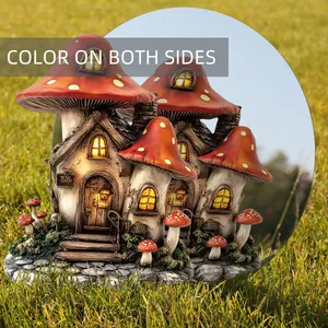 Detail of mushroom house garden stake with solar LED lights and double-sided coloring