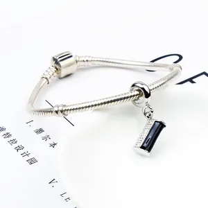 Silver snake chain bracelet featuring a black enamel rectangle charm with pavé zircon stones
