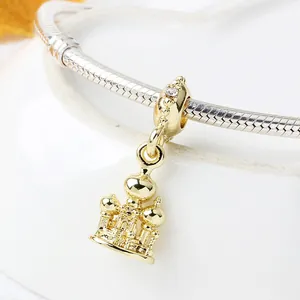 Exquisite gold castle palace charm with zircon on a silver snake chain bracelet