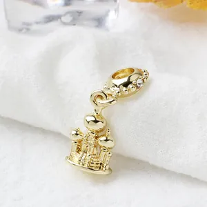 Exquisite golden castle palace charm pendant with a white diamond accent for jewelry