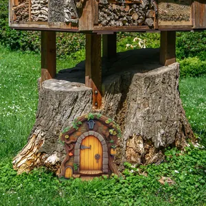 Detailed fairy garden resin door with faux wood texture and green vine ornaments