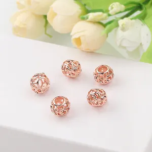 Detailed view of rose gold hollow woven beads with white zircons for DIY bracelets