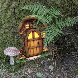 Detailed view of fairy garden tree door with glowing windows and green moss texture