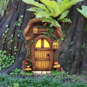 Detailed garden fairy door decor with glowing windows and mushrooms on a tree trunk