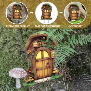 Detail of fairy garden door and mushrooms set with ground stakes for outdoor plant pots