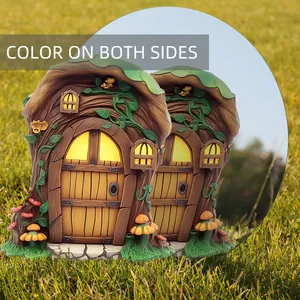 Detailed garden stake showing color on both sides of a resin tree stump fairy house