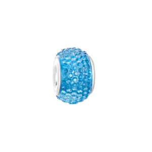 Macro detail of blue crystal resin charm bead with silver metal core for DIY bracelets