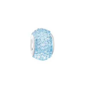 Macro detail of a light blue resin charm with pavé crystals for DIY bracelets
