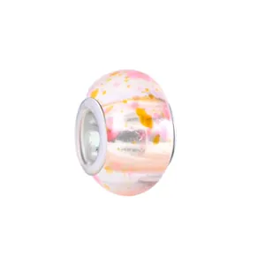 Detailed view of pink and yellow ink-patterned glass large hole bead for bracelets