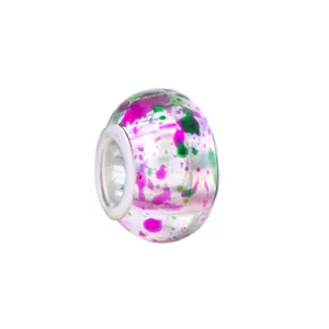 Macro detail of ink-style glass bead with purple accents and silver metal core