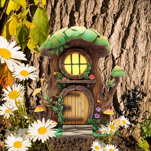 Macro detail of fairy house garden ornament with green leaf roof and glowing window