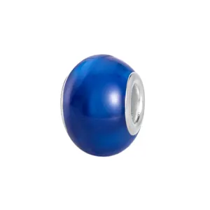 Macro view of a deep blue resin charm bead with silver metal core for DIY bracelets