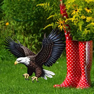 Detailed eagle garden stake with feather textures placed on a lush green lawn