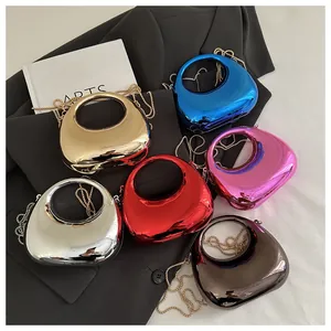 Detail of glossy metallic semi-circle handbags in six colors with chain straps