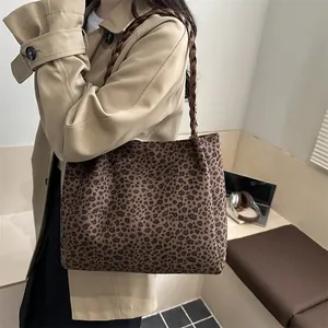 Large leopard print tote bag with woven brown handles for stylish daily commuting wear