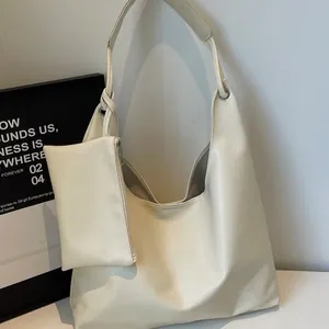 Large cream white hobo shoulder bag with knot detail and matching mini pouch accessory