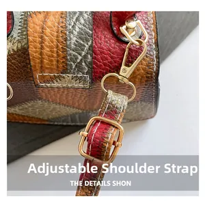 Detail of adjustable shoulder strap with gold metal buckle on patchwork leather bag
