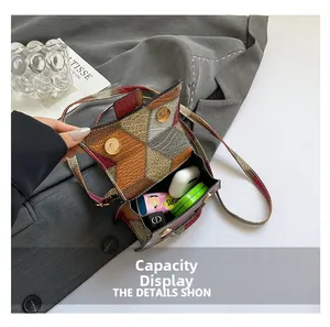 Detail showing the internal capacity of the vintage patchwork crossbody square bag