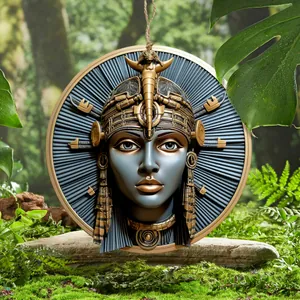 Detailed close-up of an Egyptian goddess wall plaque on a mossy stone in a garden