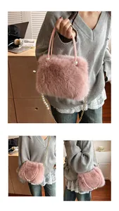 Macro shot of pink plush faux fur texture with pearl chain strap and shoulder bag details