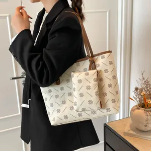 Large capacity white tote bag with brown clover pattern and small matching pouch