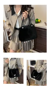 Detail of plush black handbag featuring fluffy faux fur and elegant white pearl chain strap