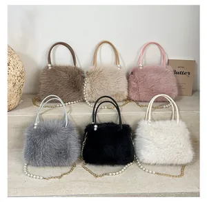 Collection of plush handbags in various colors featuring pearl handles and chain straps