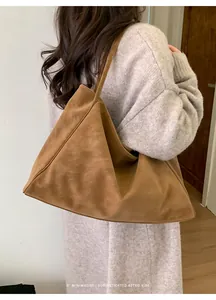 Minimalist large brown suede tote bag showing soft texture and spacious slouchy design